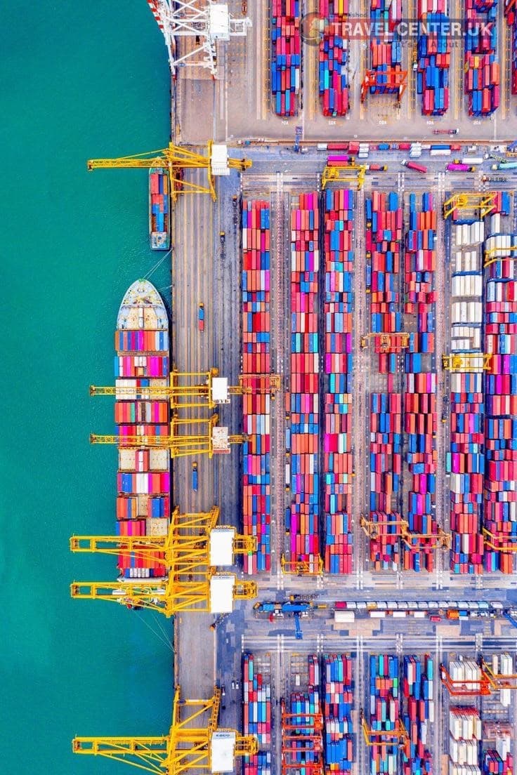 Container terminal at sunrise — gantry cranes working a berth